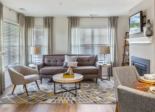 Orchards Apartments Marlborough ma apartment loft style apartments photo of living room with fireplace and large windows and modern furniture