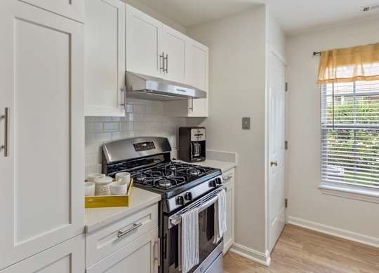Orchards Apartments Marlborough ma apartment loft style apartments photo of kitchen stainless steel appliances with gas range stove and range hood with white cabinets and wood floors