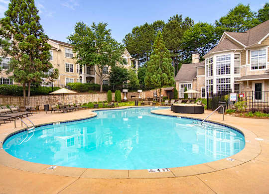 Pet-Friendly Apartments in Alpharetta, GA – The Ascent at Windward – Resort style pool with seating around the sundeck