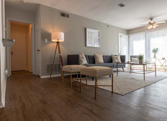 Alpharetta Apartments – Webb Bridge Crossing – living room with hardwood floors and grey walls