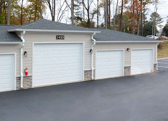 A three garage house with the number 123 on the top.