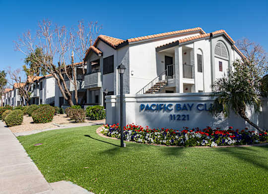 a sign for the dock bay club in front of a building