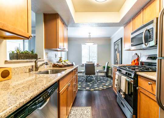 Walnut Creek, CA Apartments For Rent - Park Lake At Walnut Creek - Kitchen With Granite Countertops, Stainless Steel Appliances, Refrigerator, Gas Range, Dishwasher, Microwave, And Lots Of Cabinet Space
