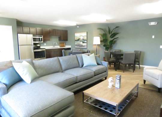 a living room with a couch and a table