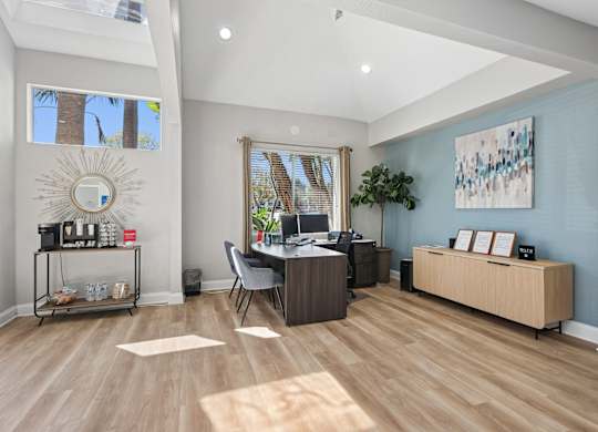 A room with a desk and a chair in it.