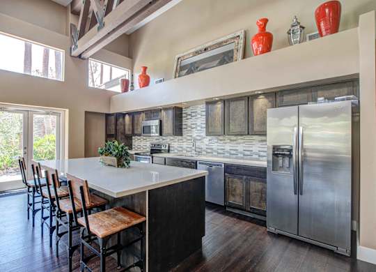 Apartments for Rent in San Clemente, CA- Rancho Del Mar - Resident Lounge & Kitchen featuring Stainless-Steel Appliances and Island with seating