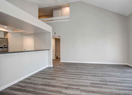 One Bedroom apartments in San Clemente CA- Rancho Del Mar - Spacious Living Room featuring Hardwood-Inspired Flooring & lots of natural light
