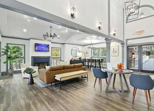 A modern living room with a fireplace and a television.