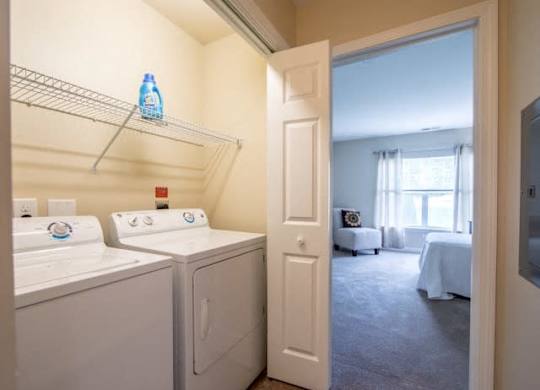 a white washer and dryer in a room