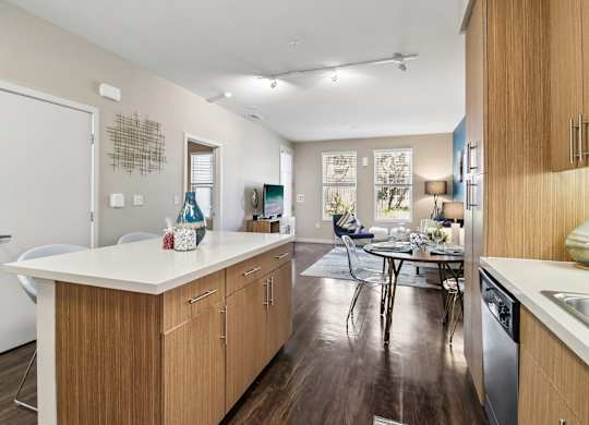 A kitchen with wooden cabinets and a white countertop.