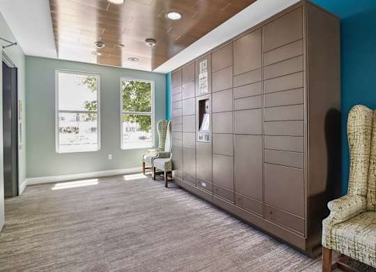A room with a brown cabinet and a chair with a patterned upholstery.