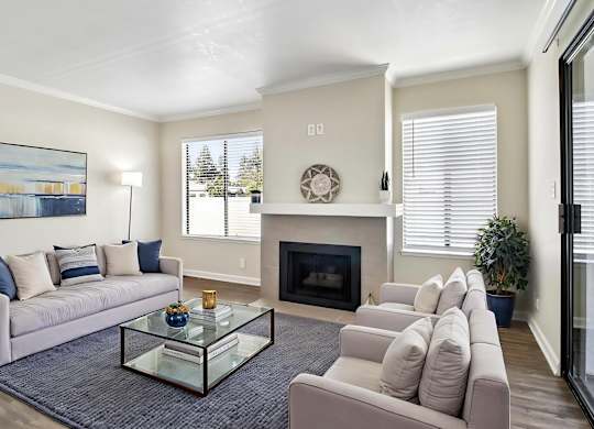 A living room with a fireplace and a couch.