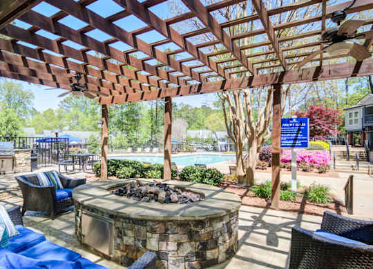 Apartments in Marietta Georgia for Rent – Wood Pointe Apartments - A patio with a fire pit and seating area.