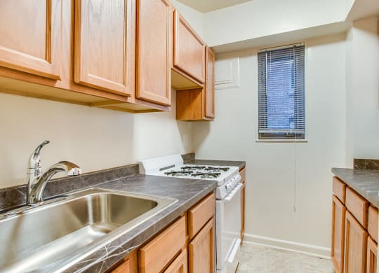 Apartment kitchen with classic finishes at 2100 Connecticut, Washington, DC, 20008