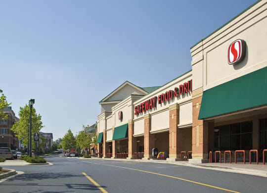 a shopping center with a sign on the front of it at The Residences at King Farm, Rockville, Maryland