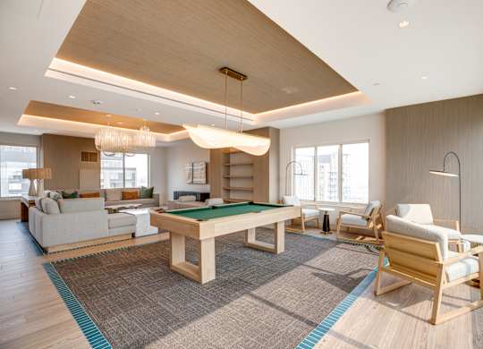 Newly renovated rooftop resident lounge with pool table at Lenox Club Apartments in National Landing, VA 22202