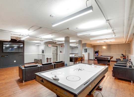 Game room with air hockey at Mason Hall in Alexandria, VA 22314