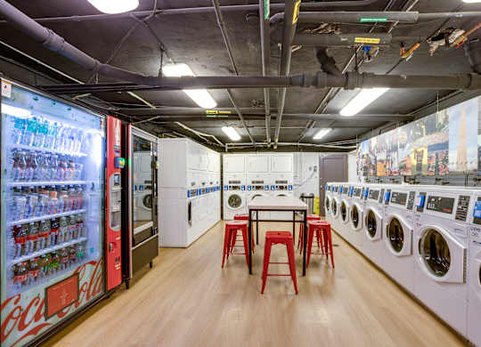 Laundry room with vending machines at Mason Hall in Alexandria, VA 22314