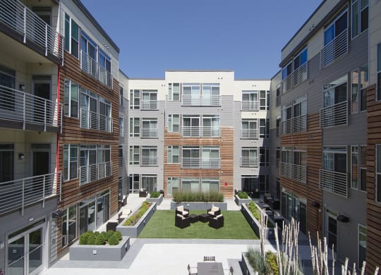 Building exterior and courtyard with grills at 2255 Wisconsin, Washington, Washington