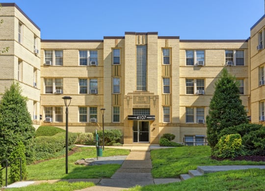 a large apartment building with a walkway in front of it at Park Crest Apartments, Washington, DC 20007