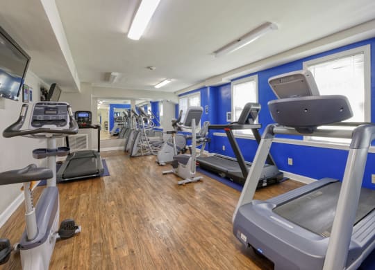 a gym with cardio equipment and treadmills at Park Crest Apartments, District of Columbia 20007