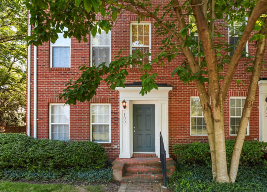 a house with a tree in front of it at The Residences at King Farm, Rockville, Maryland
