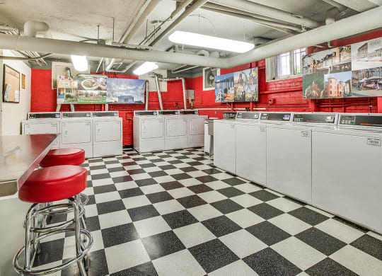 Laundry room with seating area at Highview and Castle Manor, Washington, DC