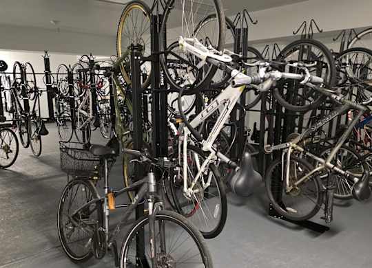A room full of bicycles of various sizes and colors.