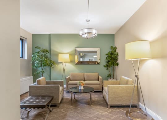 a living room with couches and chairs and a table