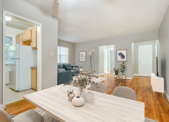 Apartment living and dining area (virtually staged) at Mason Hall in Alexandria, VA 22314