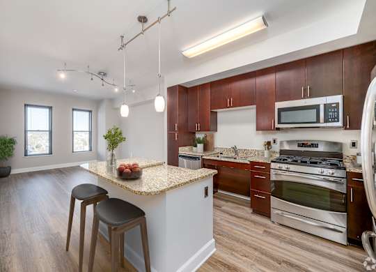 Kitchen with granite countertop and stainless steel appliances at Park Place at Petworth, Washington, DC 20011