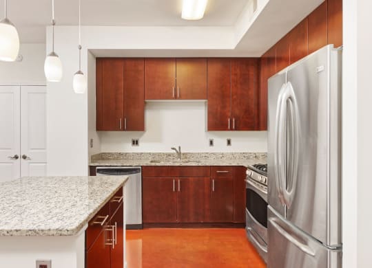 Kitchen with granite countertop and stainless steel appliances at Park Place at Petworth, Washington, DC 20011
