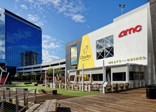 a large white building with a large yellow sign on the side of it