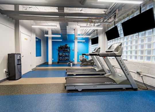 Fitness center with cardio equipment at The Diplomat Apartments in DC