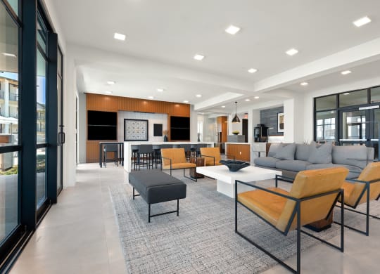 a living room with couches and chairs and a table