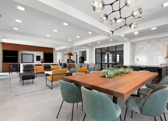 a large dining room with a wooden table and chairs