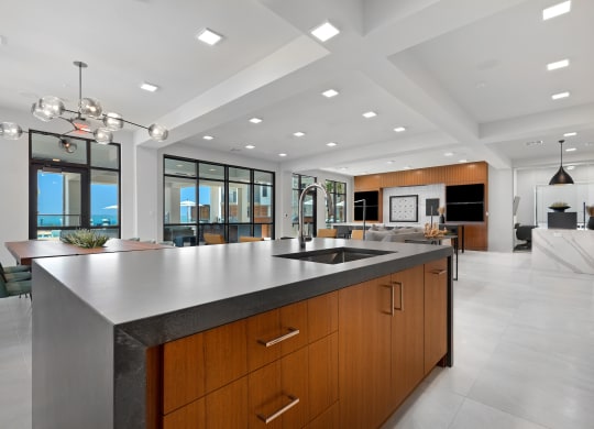 a large kitchen with a large island and a sink