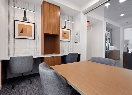 a conference room in an office space with a table and chairs