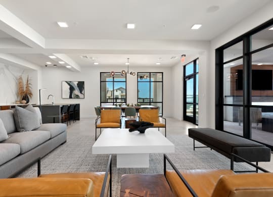a living room with couches and chairs and a table
