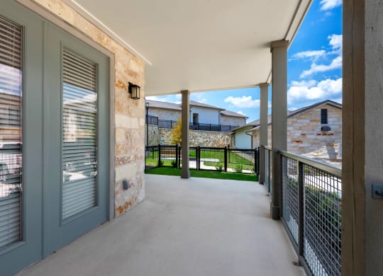 the private balcony has views of the yard and the house