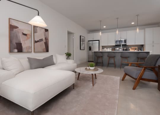 a living room with a white couch and a table