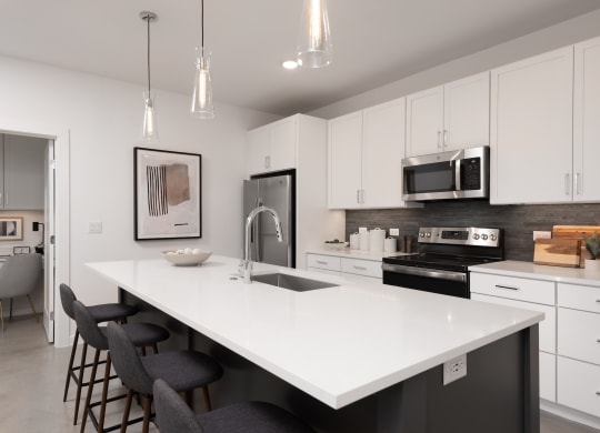 an open kitchen with a large white counter top