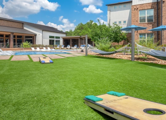 The Atwater Apartments Outdoor Lounge Area with Hammocks and Games