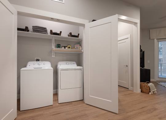 A laundry room with a washer and dryer.
