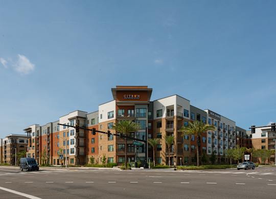 A modern apartment complex with a variety of colors on the buildings.