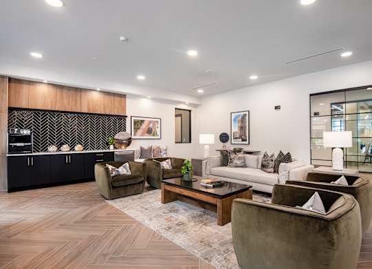A modern living room with a wooden floor and furniture.