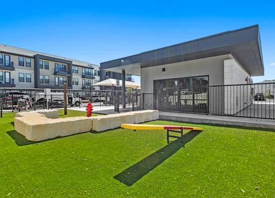 A modern building with a playground in front.