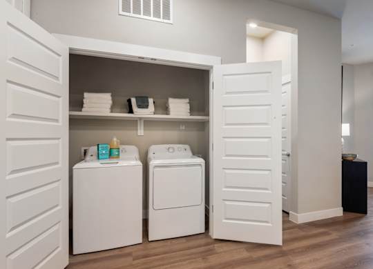 A laundry room with a washer and dryer.