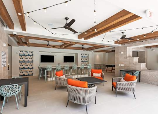 A room with a lot of chairs and a table.