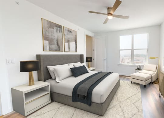 a bedroom with a large bed and a ceiling fan